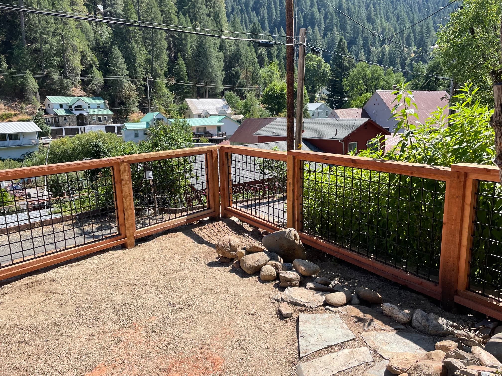 Custom wood frame and wire fence on deck overlooking Downieville