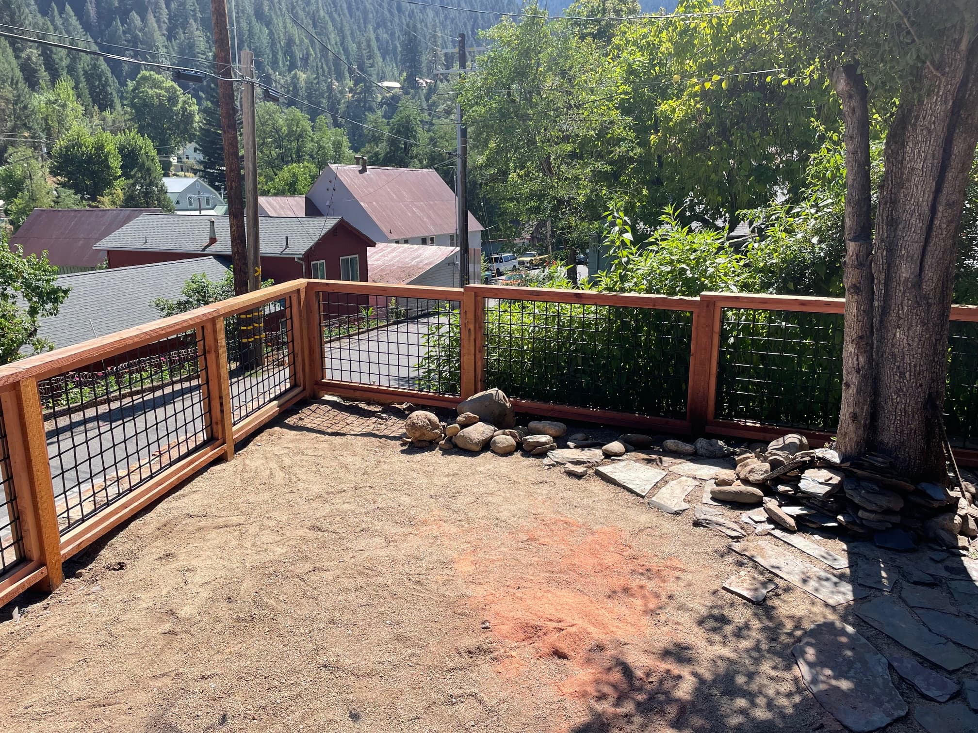 Wide view of deck fence with mountain town in background