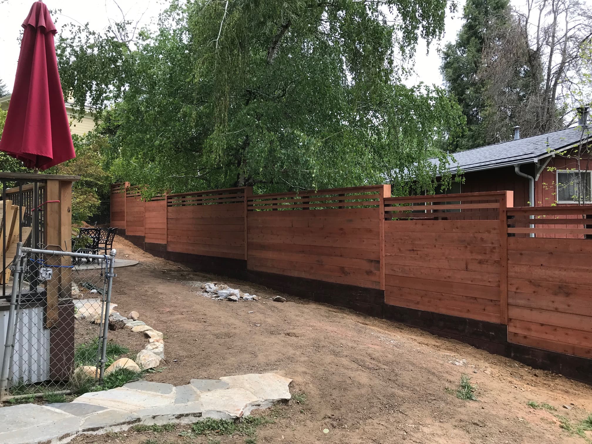 Redwood horizontal fence with slatted top section, full run