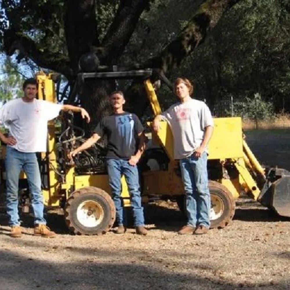 Pete and his crew in front of their equipment — Sta-Bull Fence